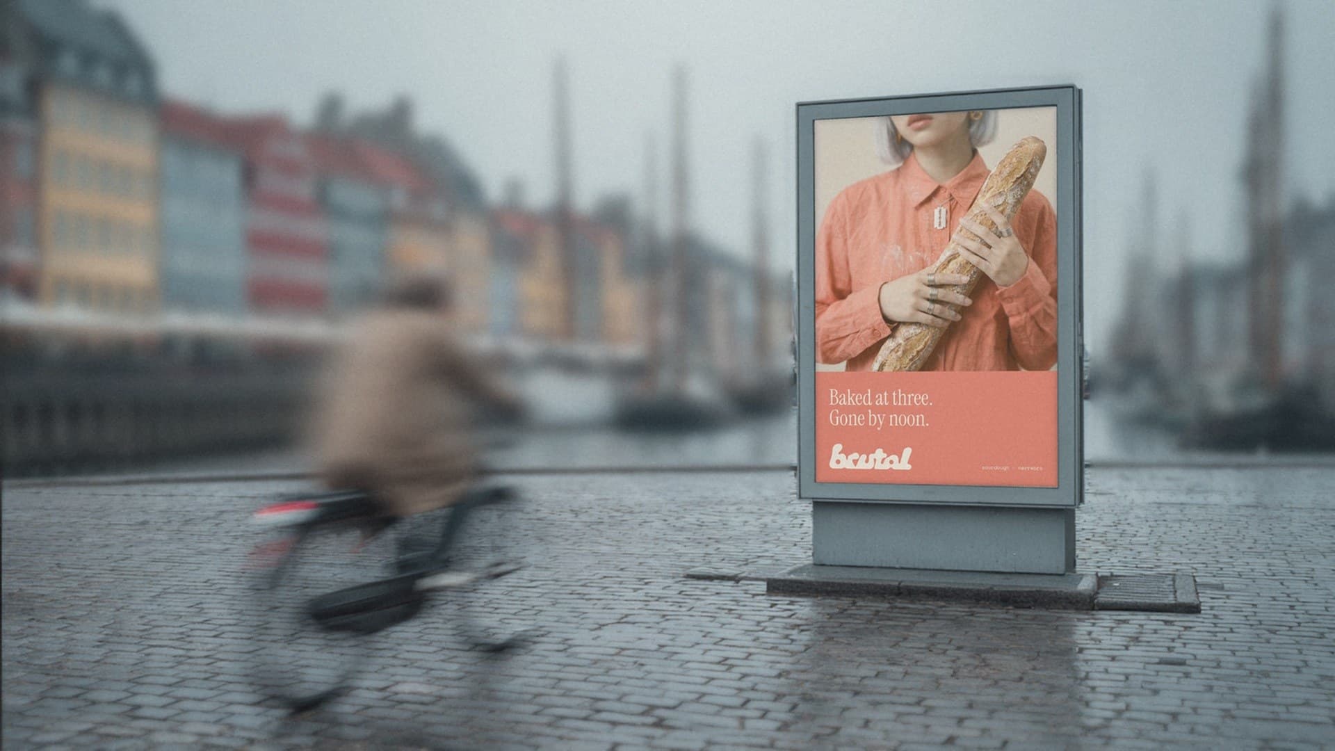 A BRUTAL poster in a lightbox on the quay in Nyhavn, Copenhagen