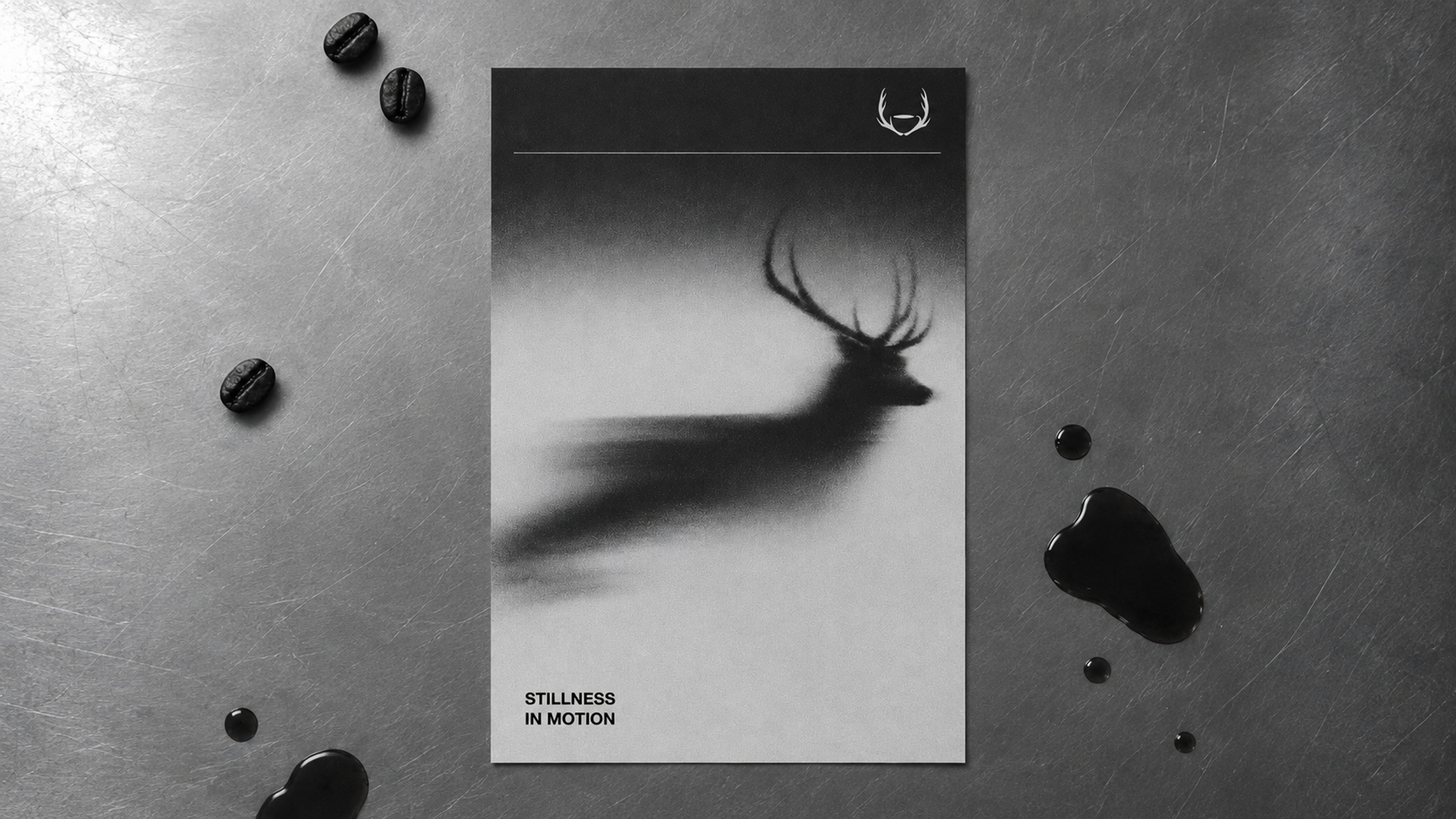 The Stillness in Motion poster on aluminium, coffee beans and spilled drops around it