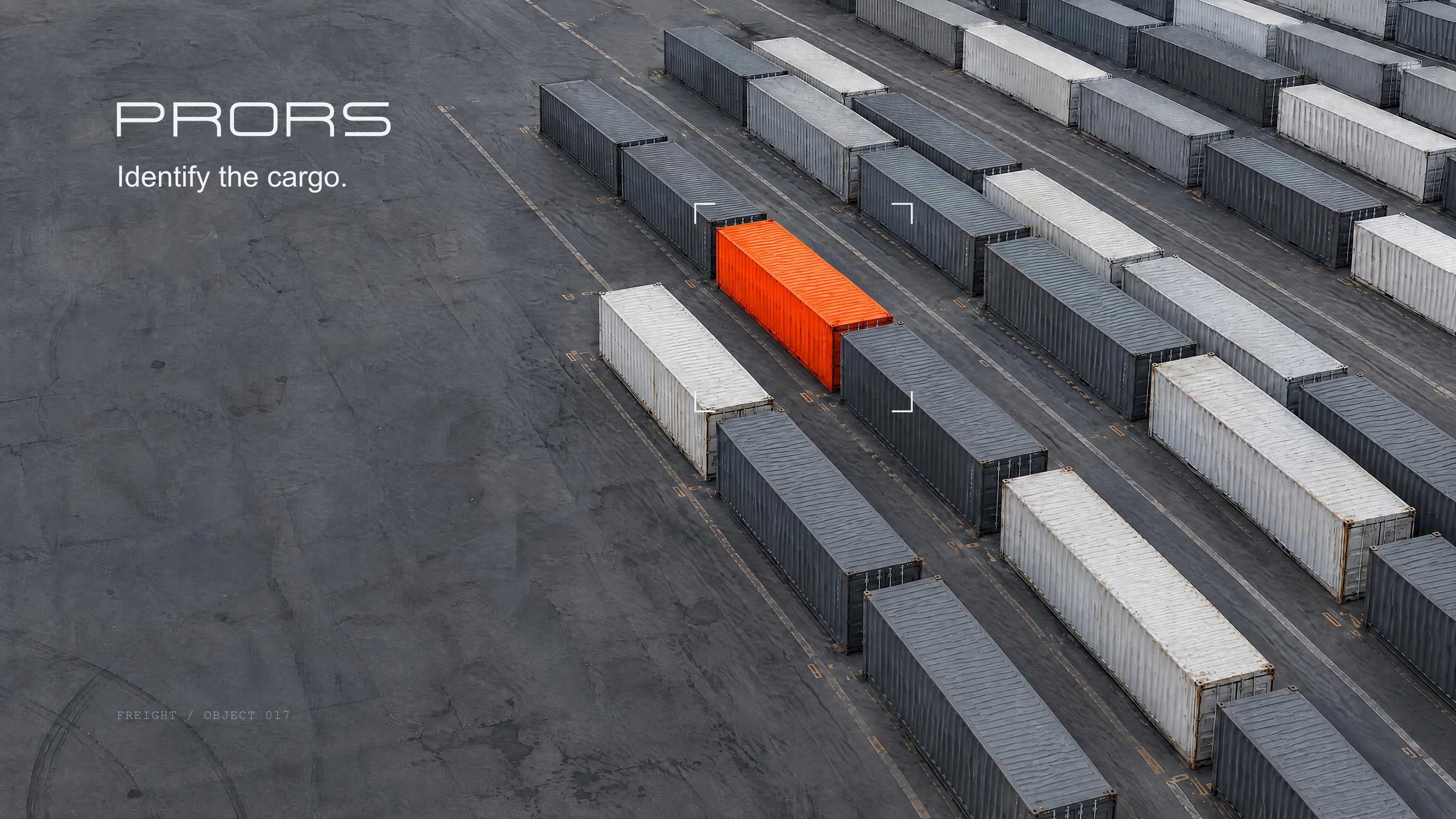 PRORS at a container terminal, one orange container among grey ones.