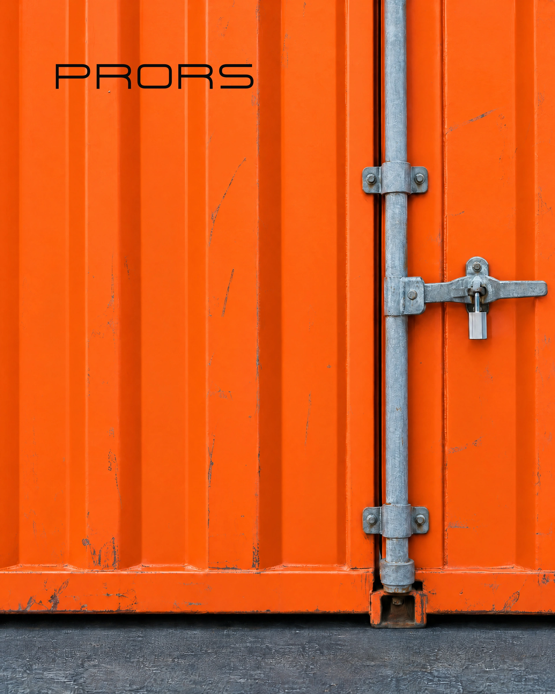 The PRORS wordmark on the door of an orange shipping container.